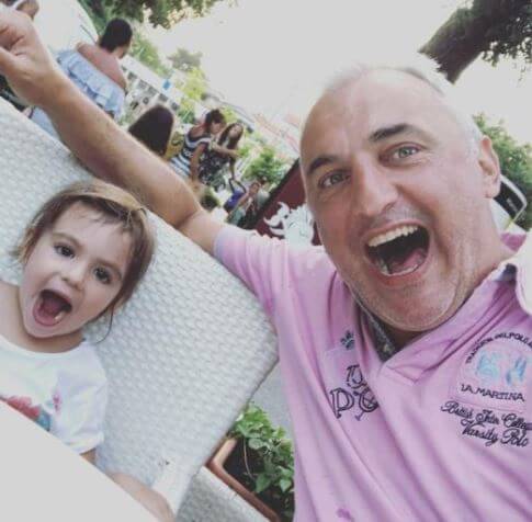 Sasa Doncic with a baby girl enjoying vacation.